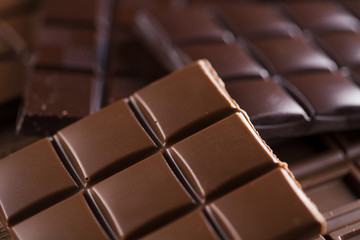 Bars Chocolate , candy sweet, dessert food on wooden background