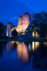 Fototapeta premium View of the Olavinlinna fortress on august night. Savonlinna, Finland