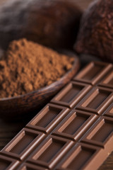 Chocolate bar, candy sweet, dessert food on wooden background
