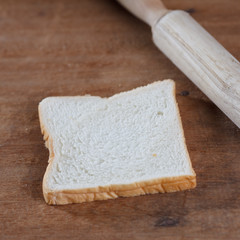 baked bread on wooden table background