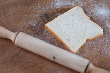 baked bread on wooden table background