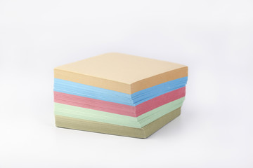 Multicolored paper stickers on a white background