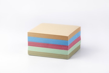 Multicolored paper stickers on a white background