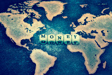 MONEY on grunge world map