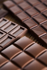 Bars Chocolate , candy sweet, dessert food on wooden background