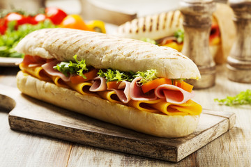 Traditional Italian sandwich with ham and cheese served warm.