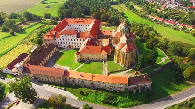 Camera flight over Benedictine monastery in Kladruby. Baroque architecture in Czech Republic. European landmarks from above.