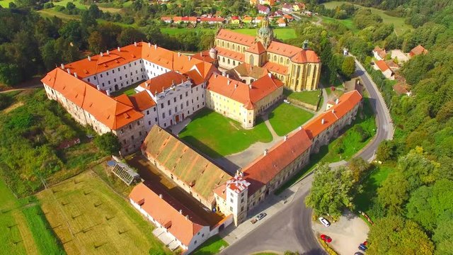 Camera flight over Benedictine monastery in Kladruby. Baroque architecture in Czech Republic. European landmarks from above.