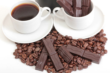 Coffee cup and chocolate on a white background