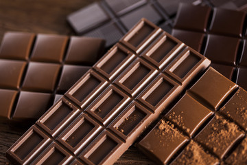 Bars Chocolate , candy sweet, dessert food on wooden background