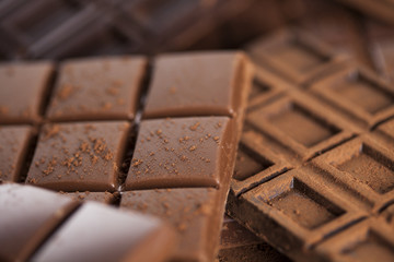 Chocolate bar, candy sweet, dessert food on wooden background