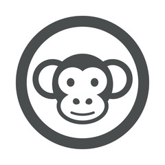 Icono plano cabeza mono en circulo color gris