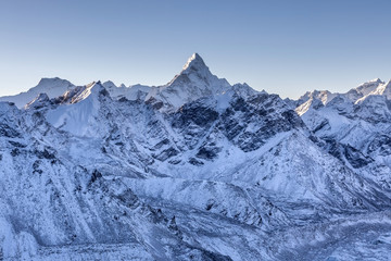 Ama Dablam mountain landscape. Sharp mountain peak standing out among Himalayan mountain range. Amazing mountain range scenery on the way to Everest Base Camp Trek.