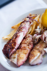 Grilled squid with lemon and fries