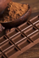 Chocolate bar, candy sweet, dessert food on wooden background
