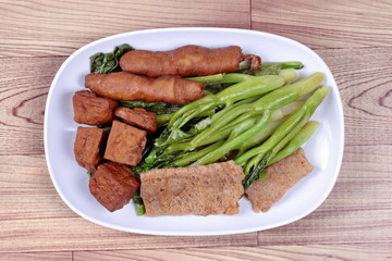 Chinese Vegetable festival  food as fried Kale with fermented flours. 