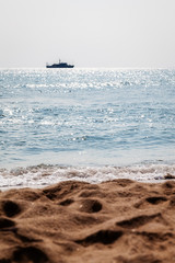 Sandy beach and ship
