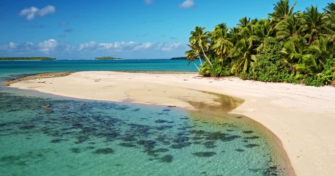 Aerial view of beautiful tropical island lagoon and white sand beach in the South Pacific