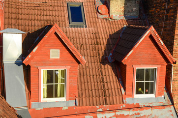 View of typical red tile roof of the Old Town of Tallinn, Estonia at sunrise.
