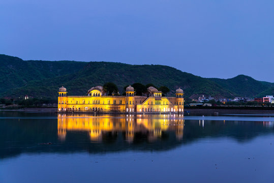 Illuminated Jal Mahal palace at night in Jaipur