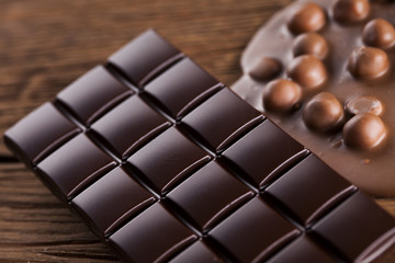 Chocolate bar, candy sweet, dessert food on wooden background