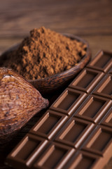 Chocolate bar, candy sweet, dessert food on wooden background