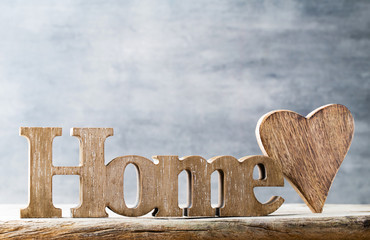 Home. Message of home with wooden letters.