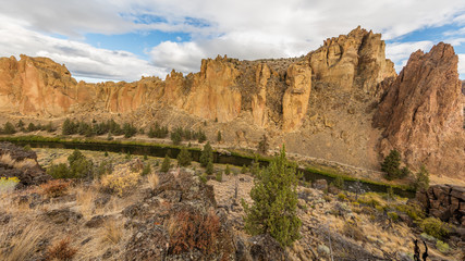 The river is flowing among the rocks. Colorful Canyon. Amazing landscape of yellow sharp cliffs. Smith Rock state park, Oregon