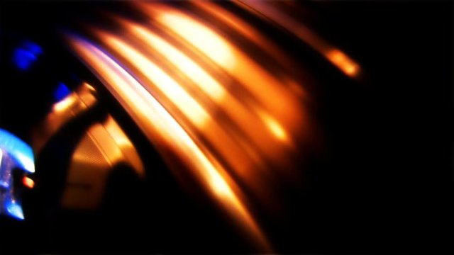 A blurred turntable rotating with lighting.