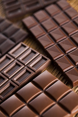 Bars Chocolate , candy sweet, dessert food on wooden background