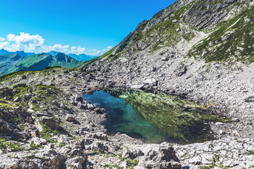 Fototapeta na wymiar Stagnant pool of water near mountain top