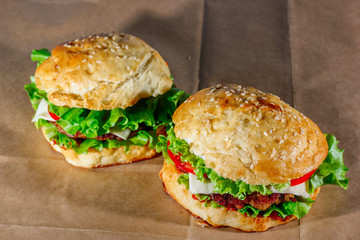 Fresh hamburgers on craft paper