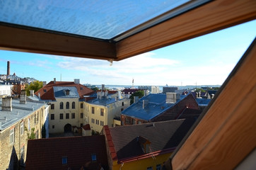 View of typical red tile roofs of the Old Town of Tallinn, Estonia at sunrise.