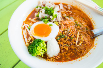 Hot and spicy noodle on the green table