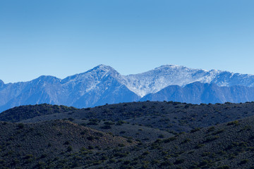 Fototapeta premium Green Landscape with snow on the Swartberg Mountain Range