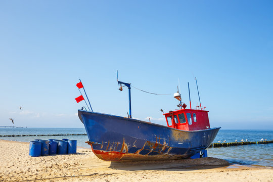 Fishing boat on the beach at summer time
