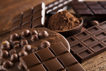 Chocolate bar, candy sweet, dessert food on wooden background
