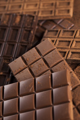 Chocolate bar, candy sweet, dessert food on wooden background