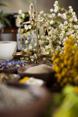 Natural medicine, herbs, mortar on wooden table background