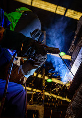 Welding steel structures and bright sparks in construction indus