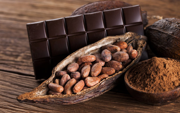 Chocolate bar, candy sweet, dessert food on wooden background