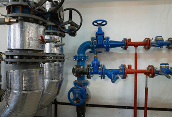 Place in a large industrial boiler room.