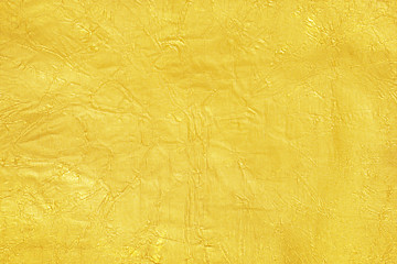 Shiny yellow leaf gold foil texture background