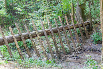 Wood barrier to prevent driftwood flowing downstream
