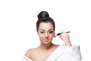 Fototapeta premium Close-up of a beauty woman doing her makeup