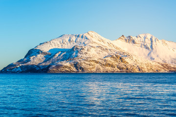 Norwegian Snow Mountains with Fjord close to Tromso