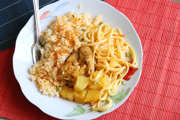 Bowl of Chicken with Rice, Potatoes and Noodles