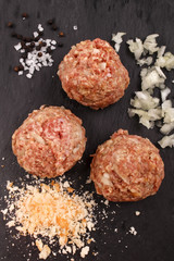 round meat balls with chopped onion, salt, peppercorns and bread