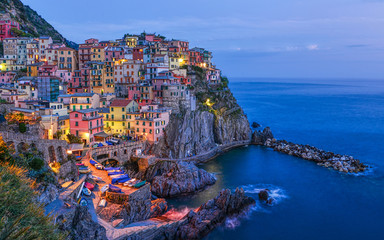 Night beautiful Manarola - one of the towns in the Cinque Terre (Liguria, Italy) - obrazy, fototapety, plakaty