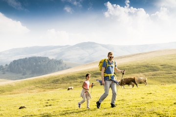 Father with daughter hiking